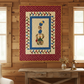 Quilt hanging on a wooden wall above a rustic table.
