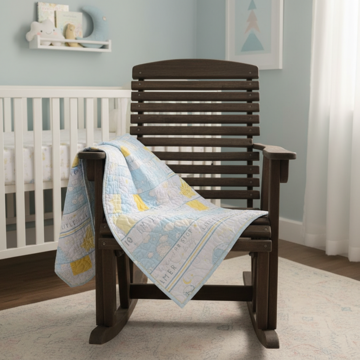 Wooden rocking chair with a baby quilt draped over it in a nursery setting.