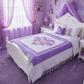 Purple-themed bedroom with a white bed and decorative elements.