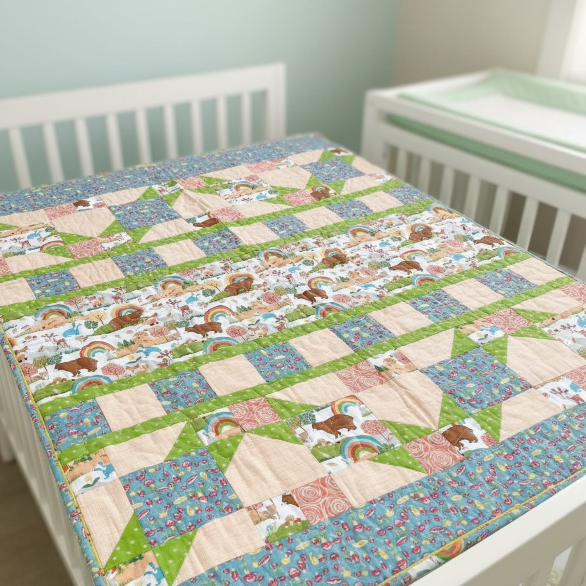Quilt with animal pattern on a crib in a nursery setting