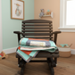 Wooden rocking chair with a colorful quilt in a nursery.