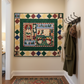 Quilt with Christmas-themed design on a wooden floor