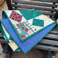 Quilt with geometric patterns on a wooden chair
