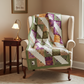Meaningful handmade log cabin quilt with faith-inspired words in soft green, purple, gold, and cream.