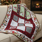 Handmade winter throw quilt with cocoa-themed panels, hot chocolate mugs, marshmallows, and festive red and green borders.