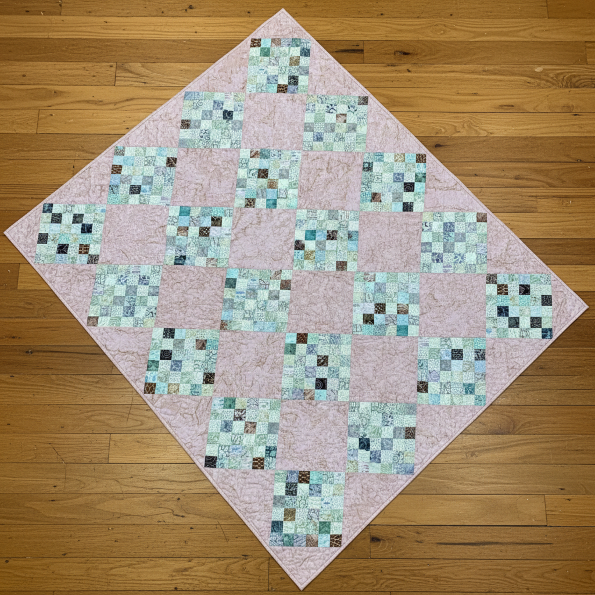 Handmade 36-patch peach lap and throw quilt with soft pastel patchwork blocks
