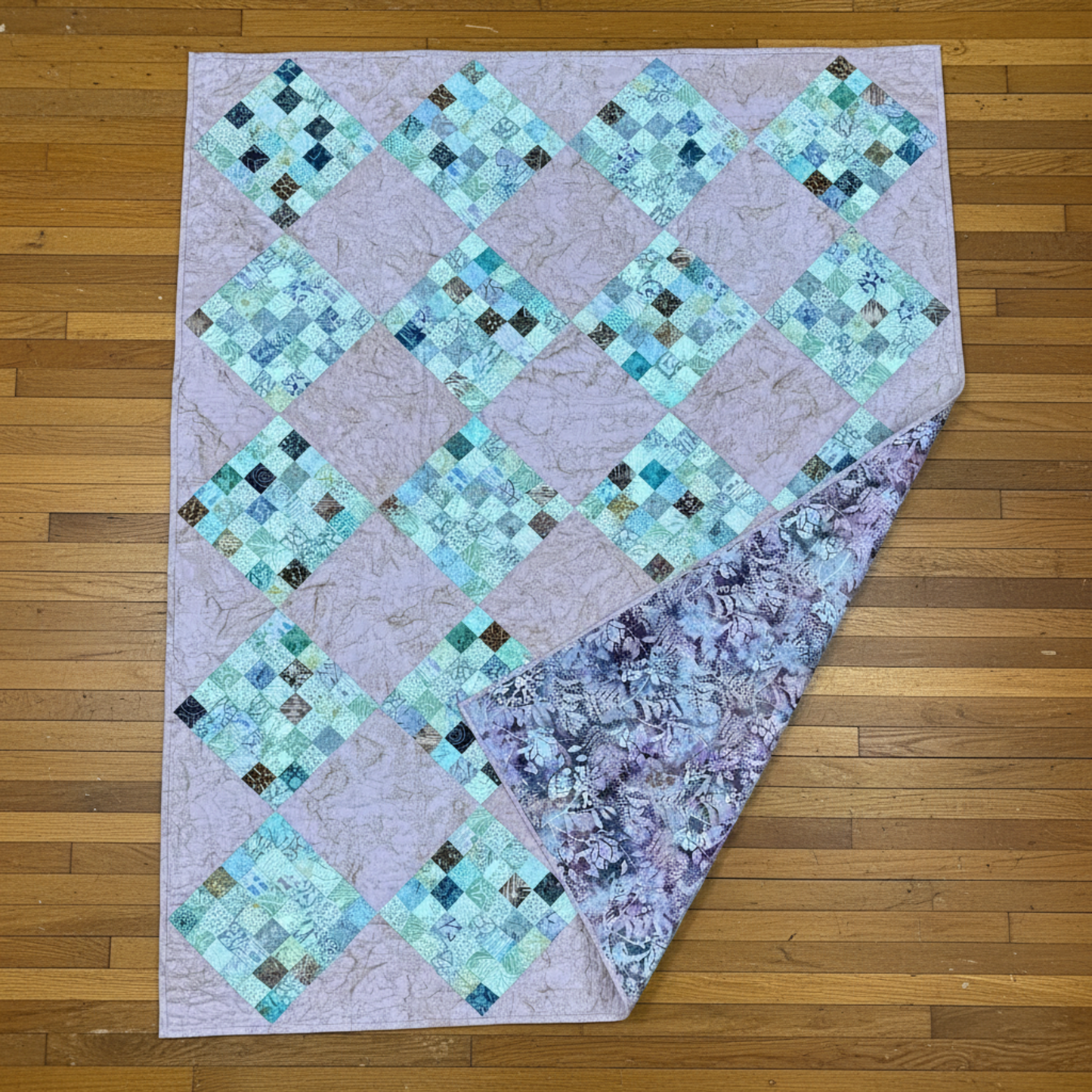 36-patch peach quilt with coordinating floral backing and classic patchwork front