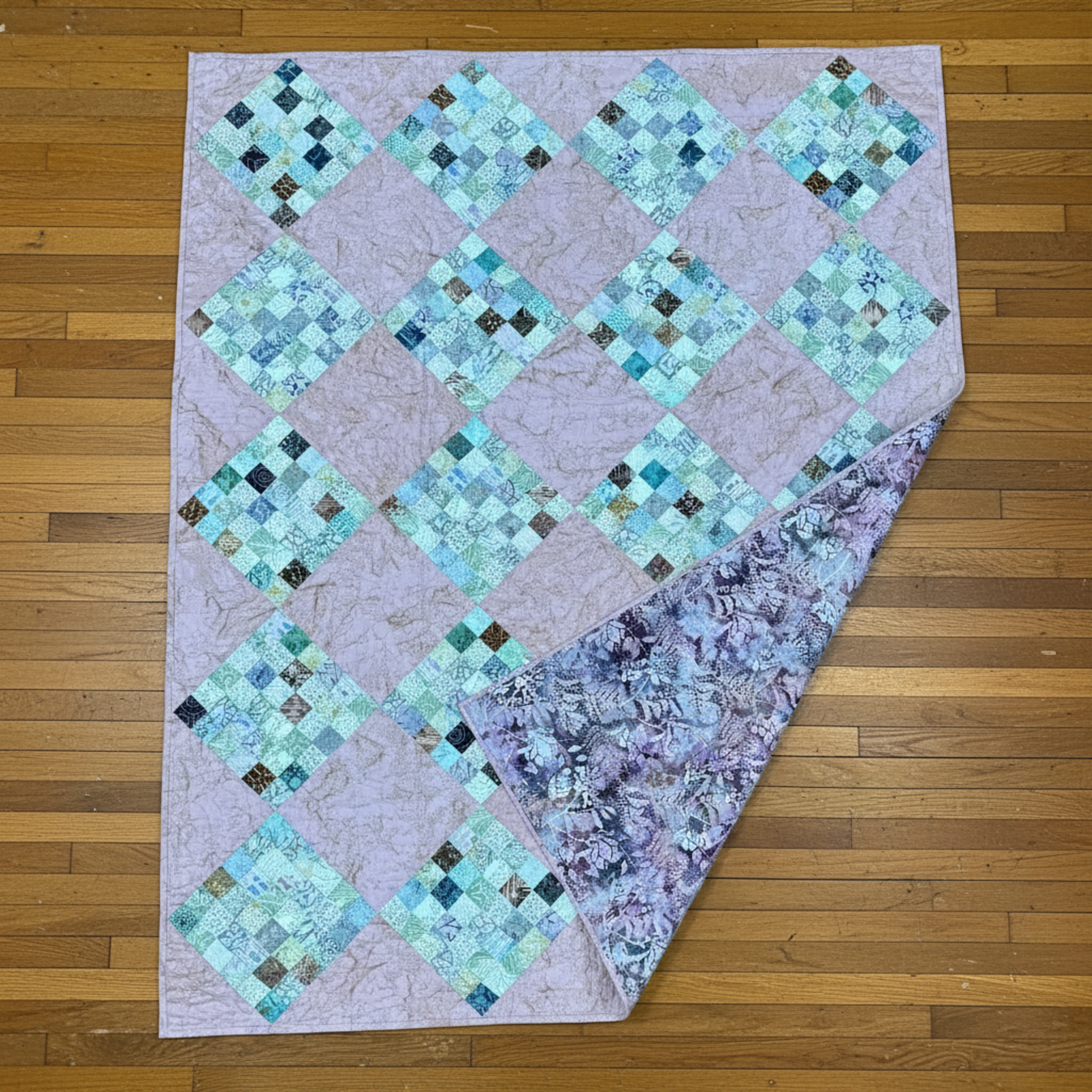 36-patch peach quilt with coordinating floral backing and classic patchwork front