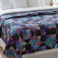 Jewels of the Night handmade quilt styled on a queen or king size bed