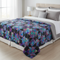 Jewels of the Night handmade quilt styled on a queen or king size bed