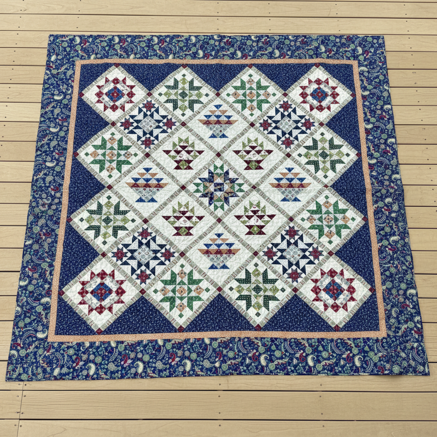 Vintage Sampler handmade queen quilt with basket and star blocks laid flat