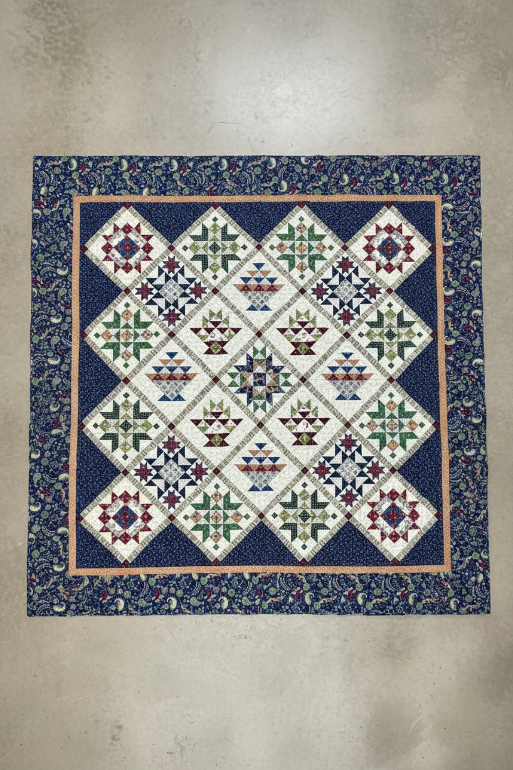 Vintage Sampler handmade queen quilt with basket and star blocks laid flat