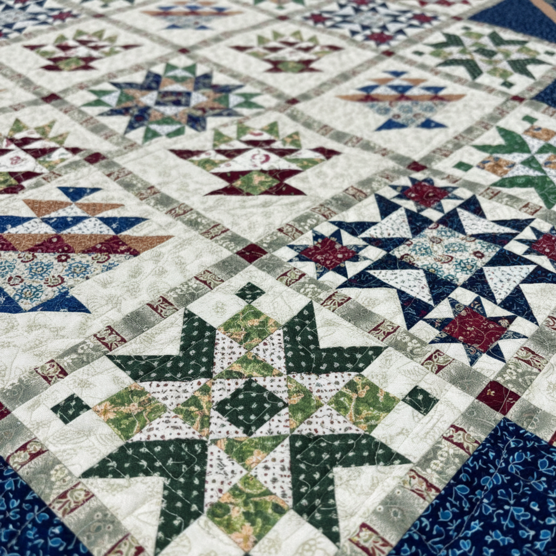 Close-up of basket and star quilt blocks with stripe sashing