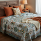 King-size bed styled with the Windsong handmade patchwork quilt in earthy seasonal tones