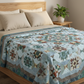 King-size bed styled with the Windsong handmade patchwork quilt in earthy seasonal tones