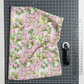 Decoupage Lilac Pink quilting cotton styled on cutting mat with ruler and rotary cutter – quilt planning lifestyle photo