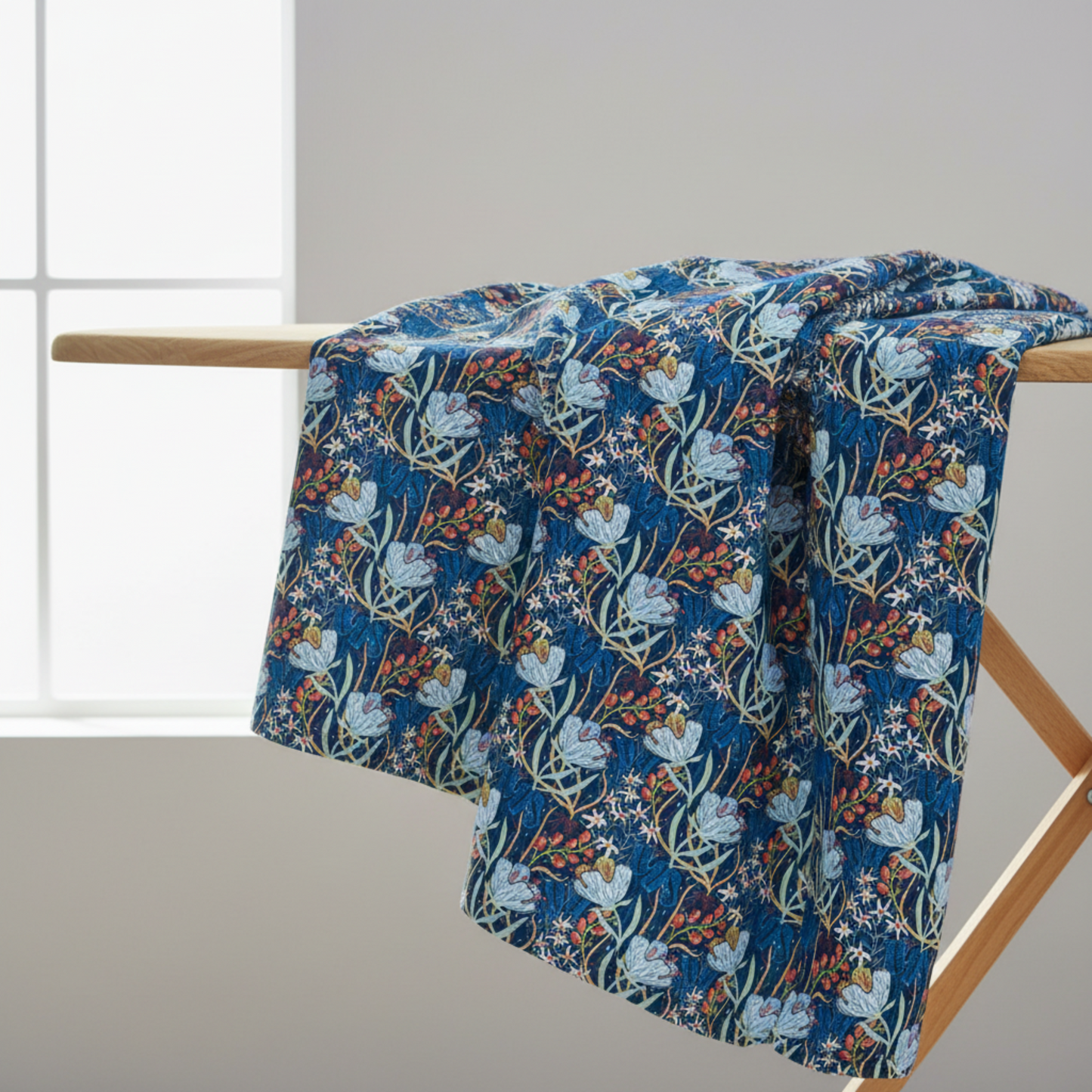 Whimsy Anemones and Berry Pods Blue fabric draped to show graceful movement and soft hand of 100% cotton