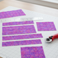 Vertical view of Prism II Blooms in Fuchsia quilting cotton - kaleidoscopic floral pattern ideal for contemporary quilts and statement borders