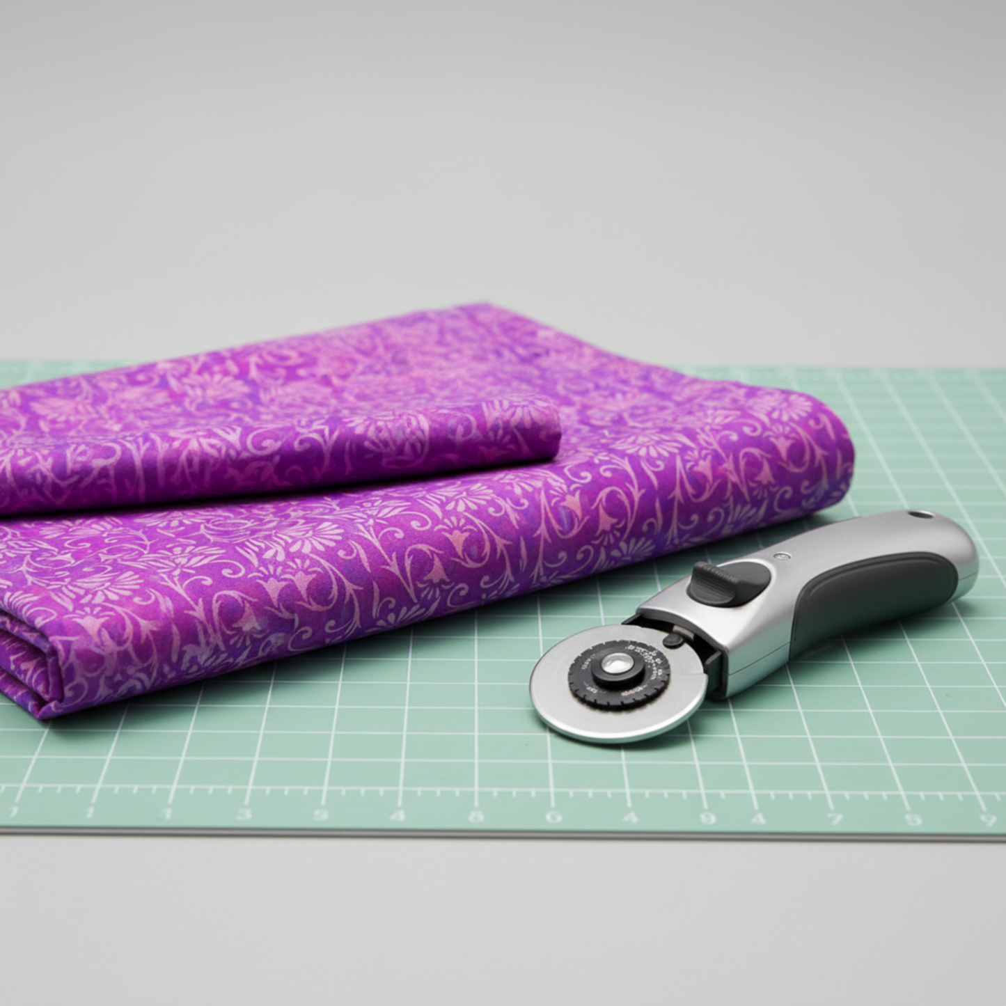Prism II Blooms in Fuchsia fabric draped to show natural movement and soft hand of 100% cotton with kaleidoscopic floral design pattern
