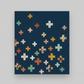Quilt with colorful crosses  on a dark blue background