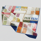 Colorful quilt with geometric pattern on a light gray background