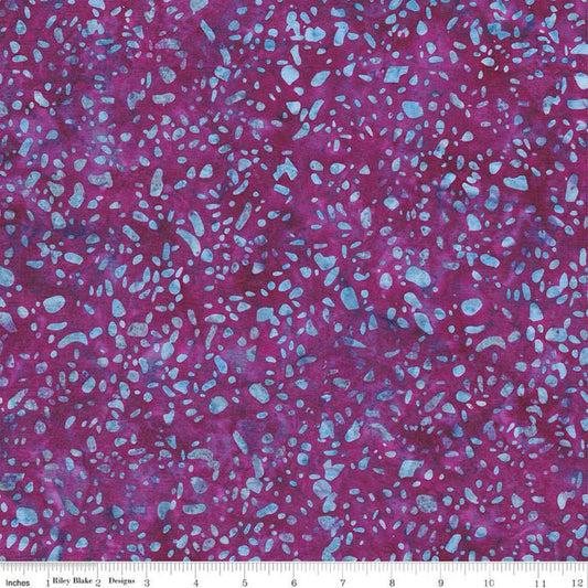 Batiks Basics Terrazzo Purple Haze fabric by Riley Blake Designs — vibrant purple hand-dyed batik with aqua terrazzo speckles, shown with a ruler for scale.