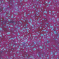 Terrazzo Purple Haze Fabric by Riley Blake Designs, with aqua-blue pebble-shaped flecks across a mottled purple-magenta background.