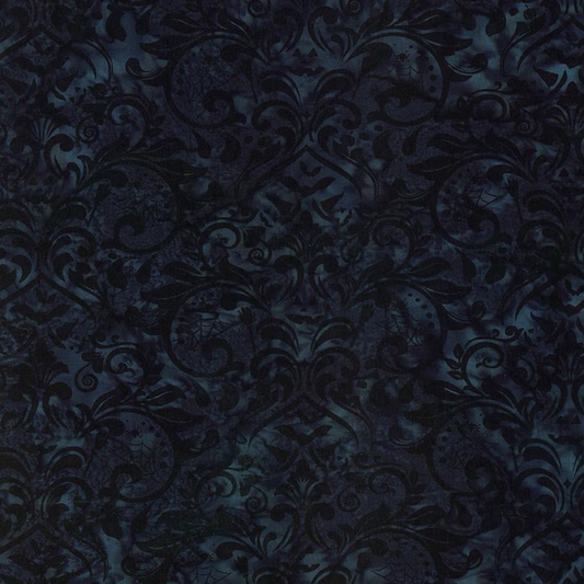 Close-up of Whispering Hollows Raven batik fabric by Riley Blake Designs, showing swirling damask motifs and subtle teal-blue mottling across a deep navy-black ground.