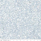 Terrazzo Powdered Pearl Fabric by Riley Blake Designs, with white and soft blush pebble-shaped flecks on a powder blue-gray background, above an inch ruler showing print scale.