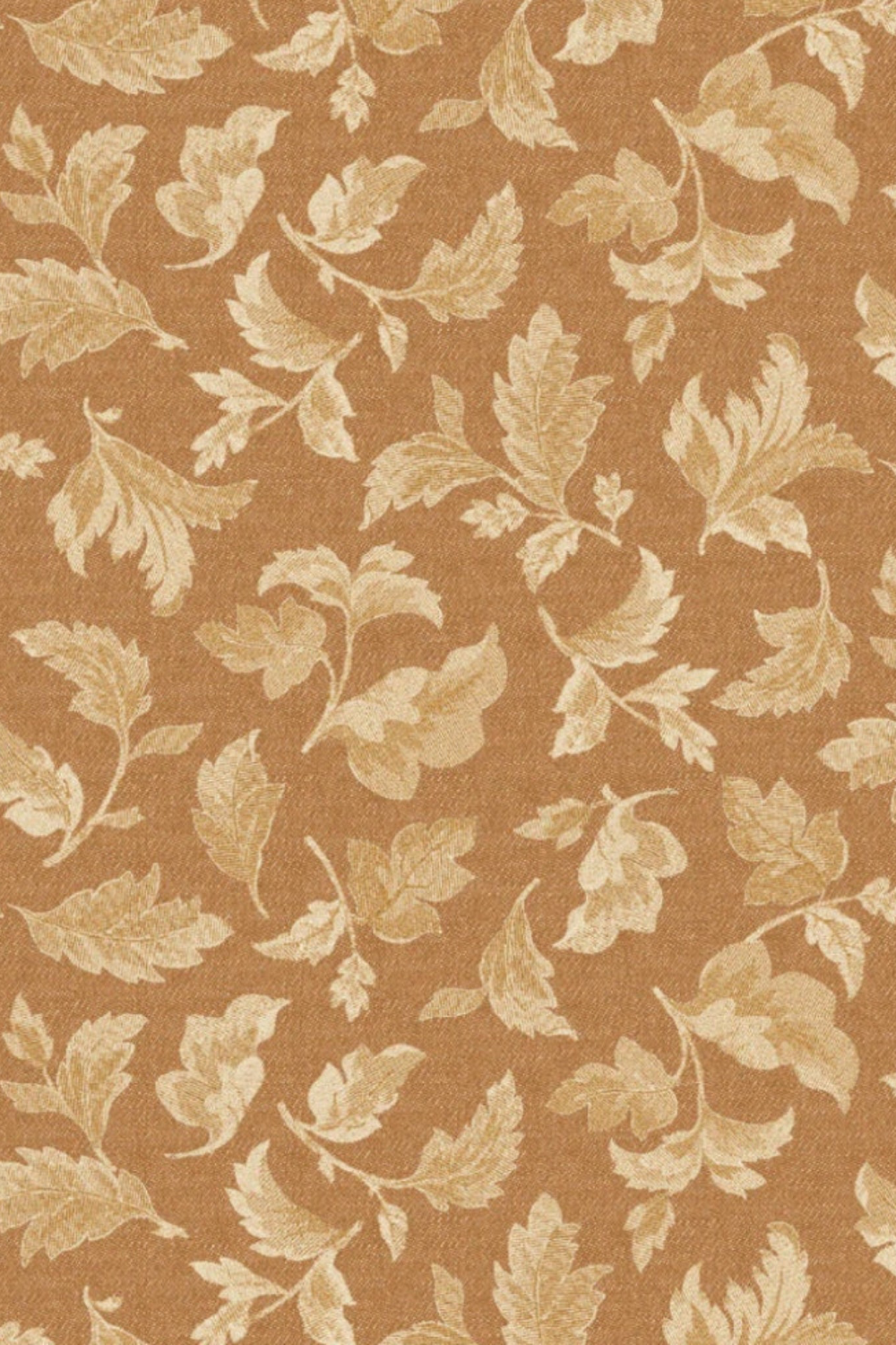 Close-up of Front Porch Swing – Rust quilting cotton by Dolores Smith, showing cream and light-gold scrolling leaf motifs on a rust-amber ground.