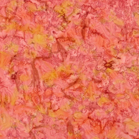 Close-up detail of Expressions Batiks Hand-Dyes Sunset quilting cotton fabric highlighting print clarity and warm multicolor hand-dyed batik texture with coral pink, golden yellow, and peach