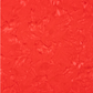 Close-up detail of Expressions Batiks Hand-Dyes Tomato Red quilting cotton fabric highlighting print clarity and vivid warm red-orange tonal hand-dyed batik texture