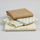 Expressions Batiks Breathe Laurel quilting cotton by Riley Blake Designs – Pinterest coordination stack of 4 folded fabrics stacked on light grey background: warm tan solid batik on top, cream and sage green interlocking circles geometric, cream sage green floral vine print, and cream ivory large floral batik on bottom