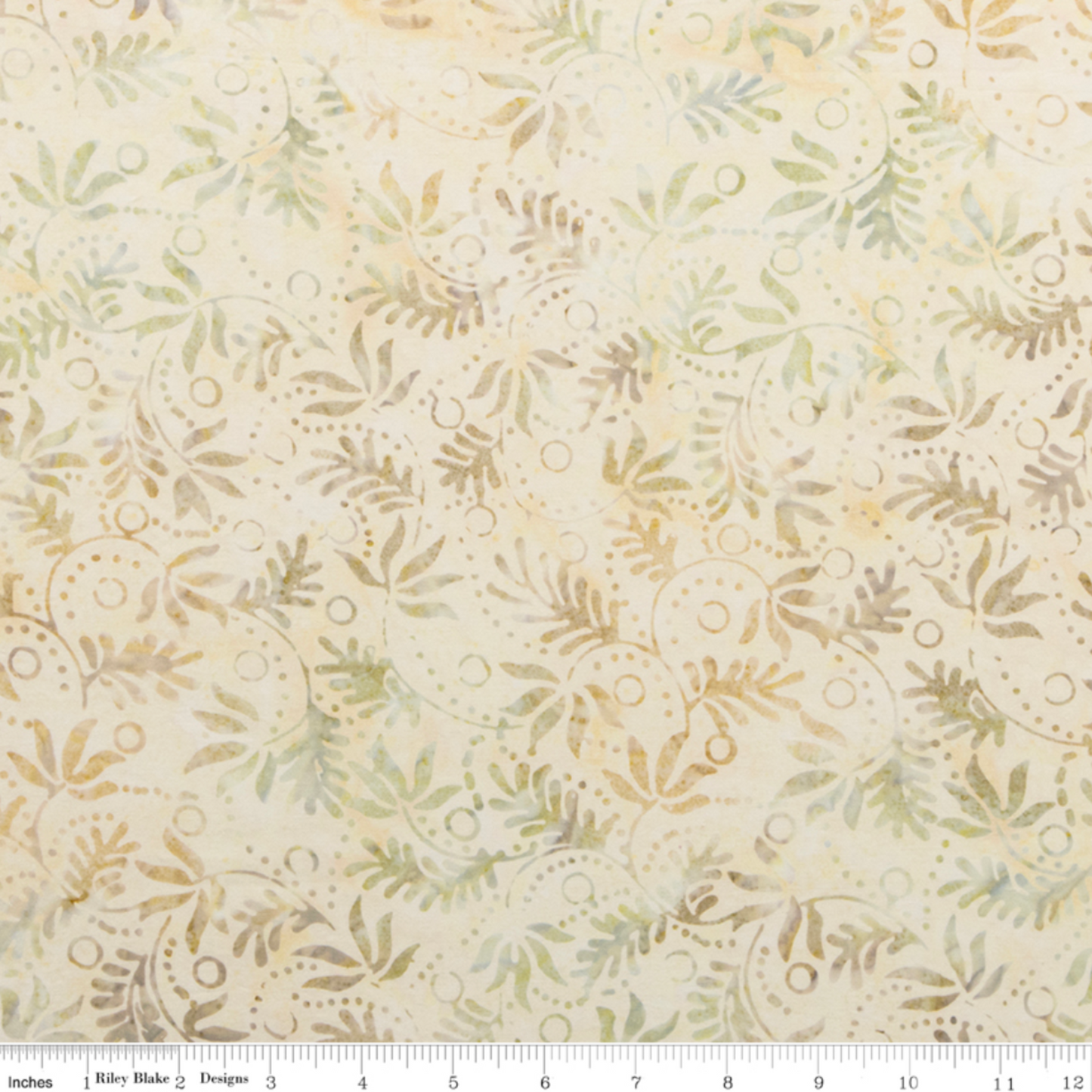 Expressions Batiks Breathe Laurel quilting cotton with Riley Blake Designs ruler showing scale of pattern repeat – cream and ivory tonal batik with feathery fronds, dotted circular swirl outlines, and tiny leaf sprigs in soft sage green and warm taupe, pattern repeat approximately 4–5 inches