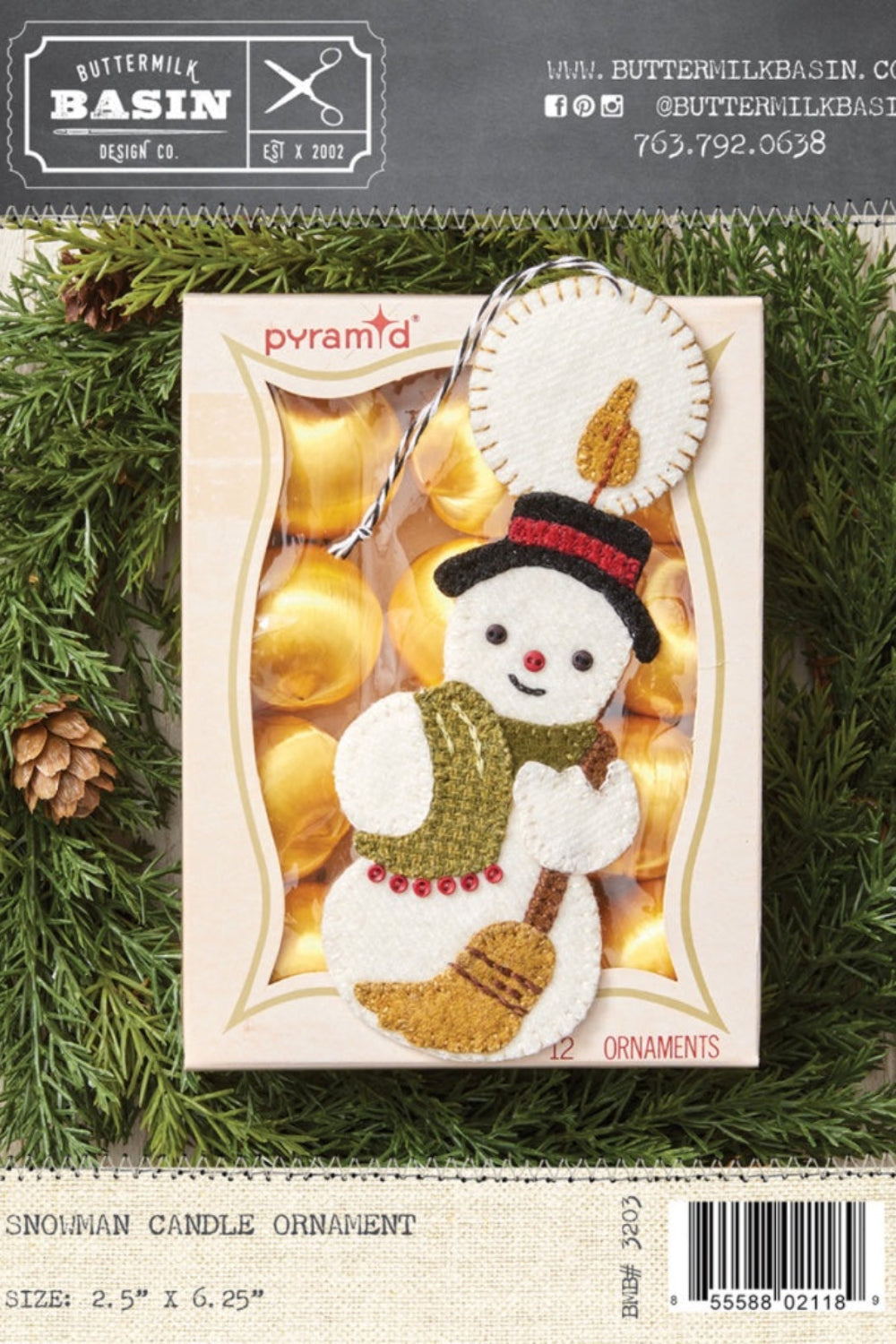 Snowman candle ornament packaging on a green leaf background