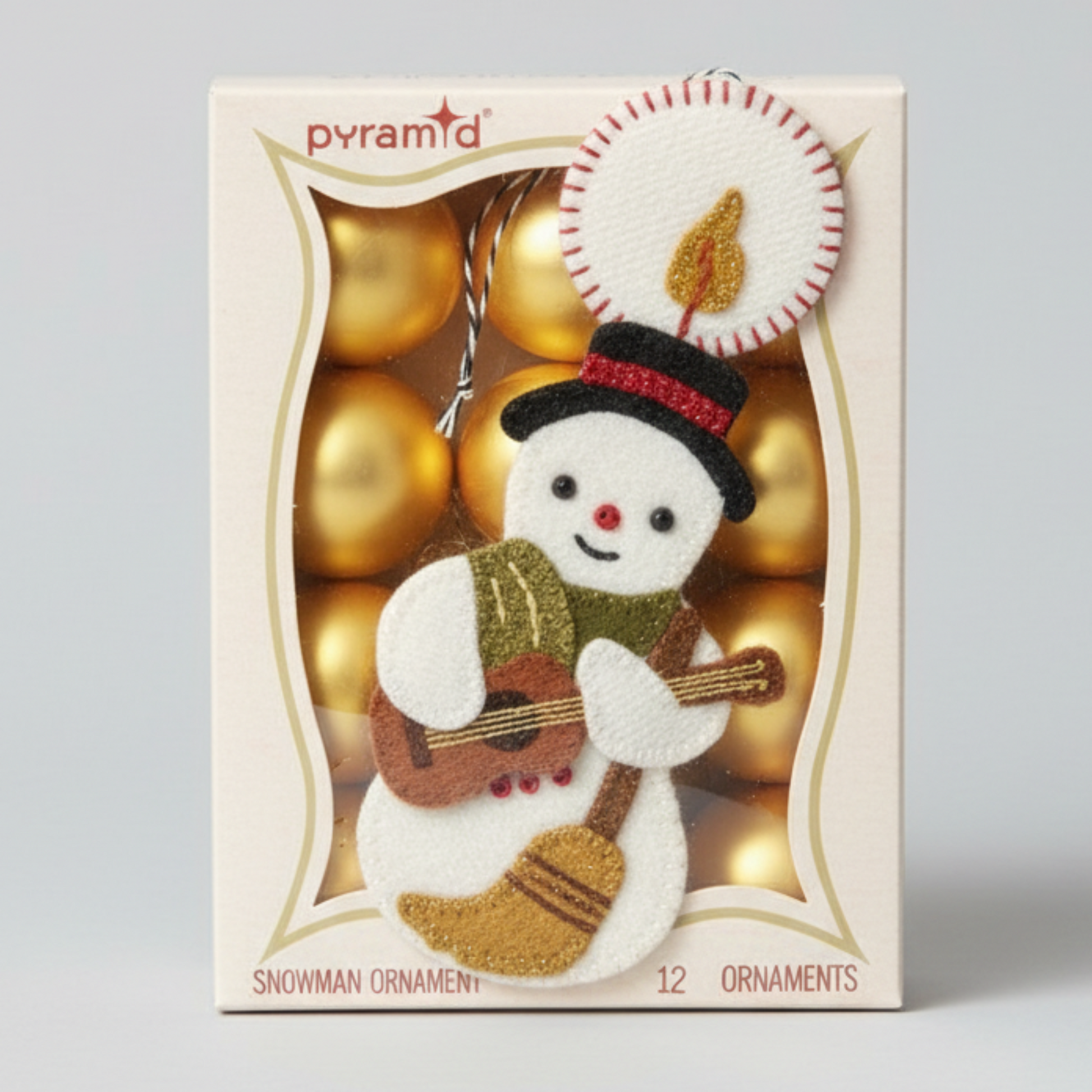 Snowman ornament with guitar in a box labeled 'pyramid' on a light gray background