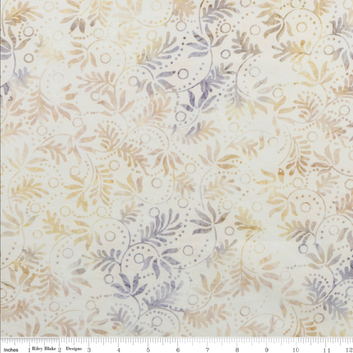 Expressions Batiks Breathe Flaxen by Riley Blake Designs – scale reference with Riley Blake ruler showing pattern repeat of swirling vine, feathery leaf sprigs, and dotted circle motifs in soft warm gold, tan, and lavender-grey on cream ground
