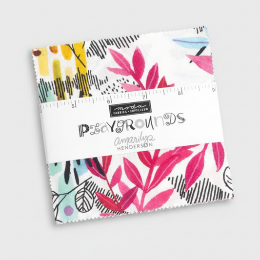 Playgrounds charm pack by Amarilys Henderson for Moda Fabrics – packaged 5" x 5" precut squares with Moda label showing bold pink botanical print with abstract mark-making, ruler for scale showing approximately 5" width