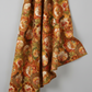 Autumn Celebration Multi Circles fabric draped to show natural fall and movement of 100% cotton material