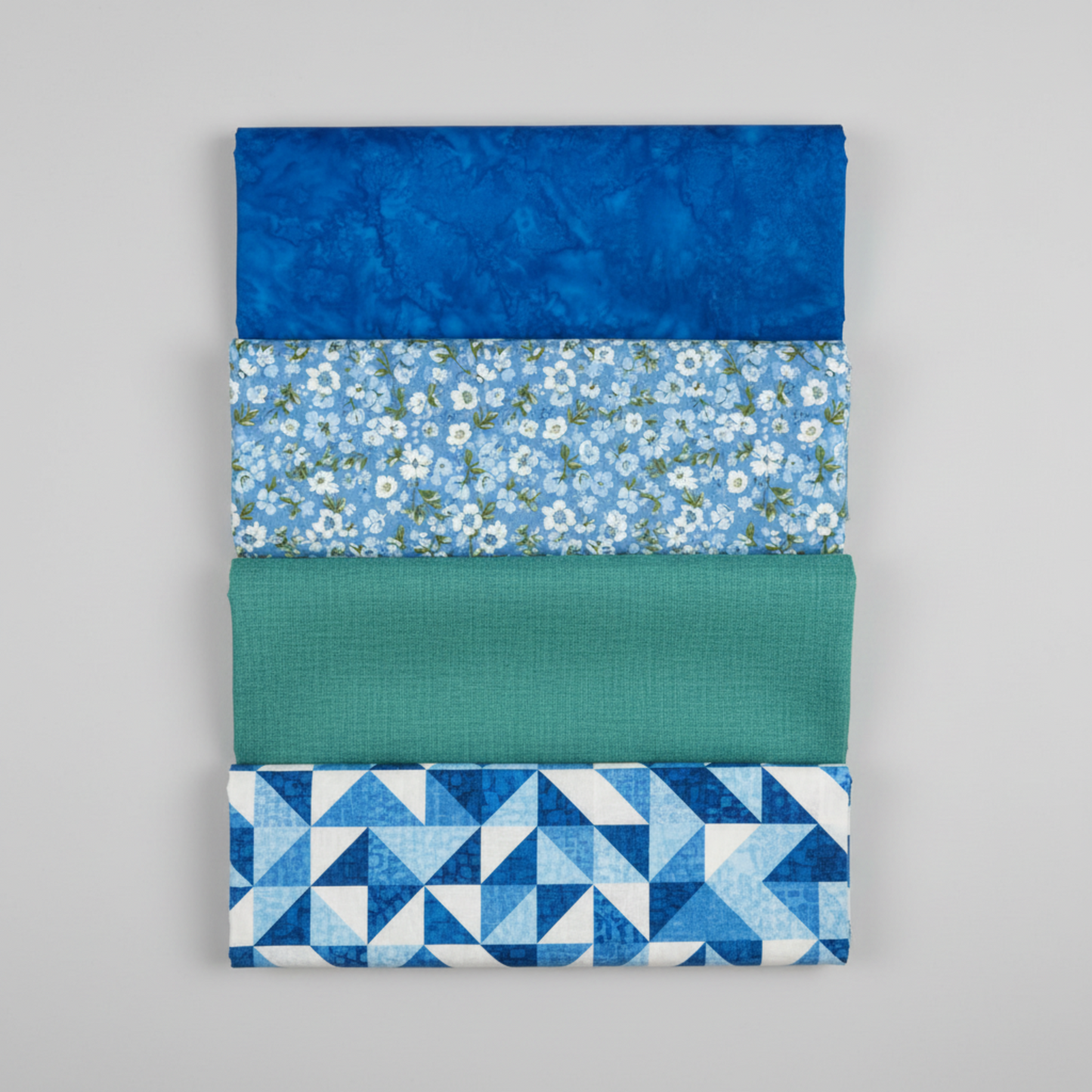 Expressions Batiks Hand-Dyed Imperial – coordination stack with 4 complementary fabrics arranged vertically on light grey background