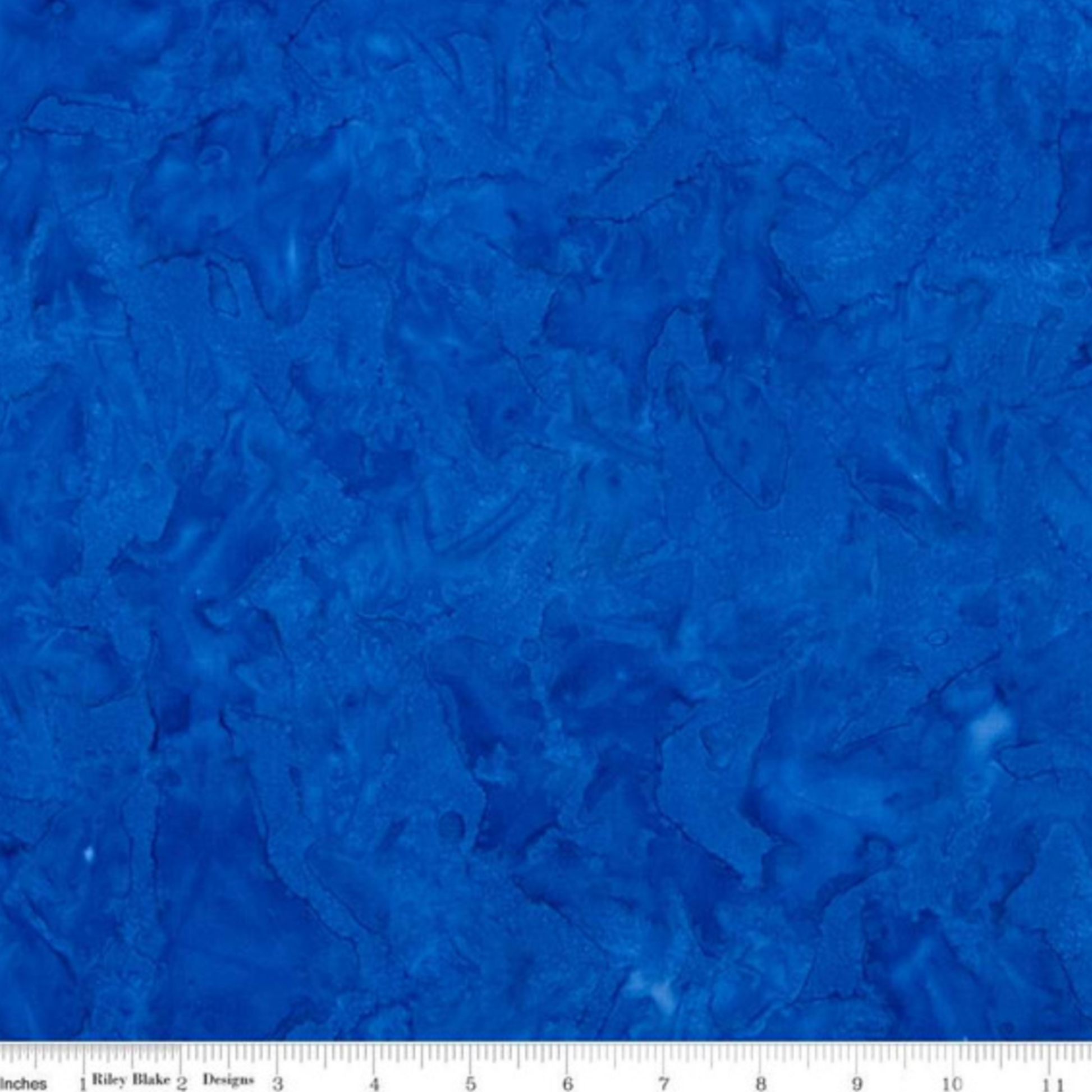 Expressions Batiks quilting cotton with ruler showing scale of pattern repeat – cobalt blue hand-dyed batik