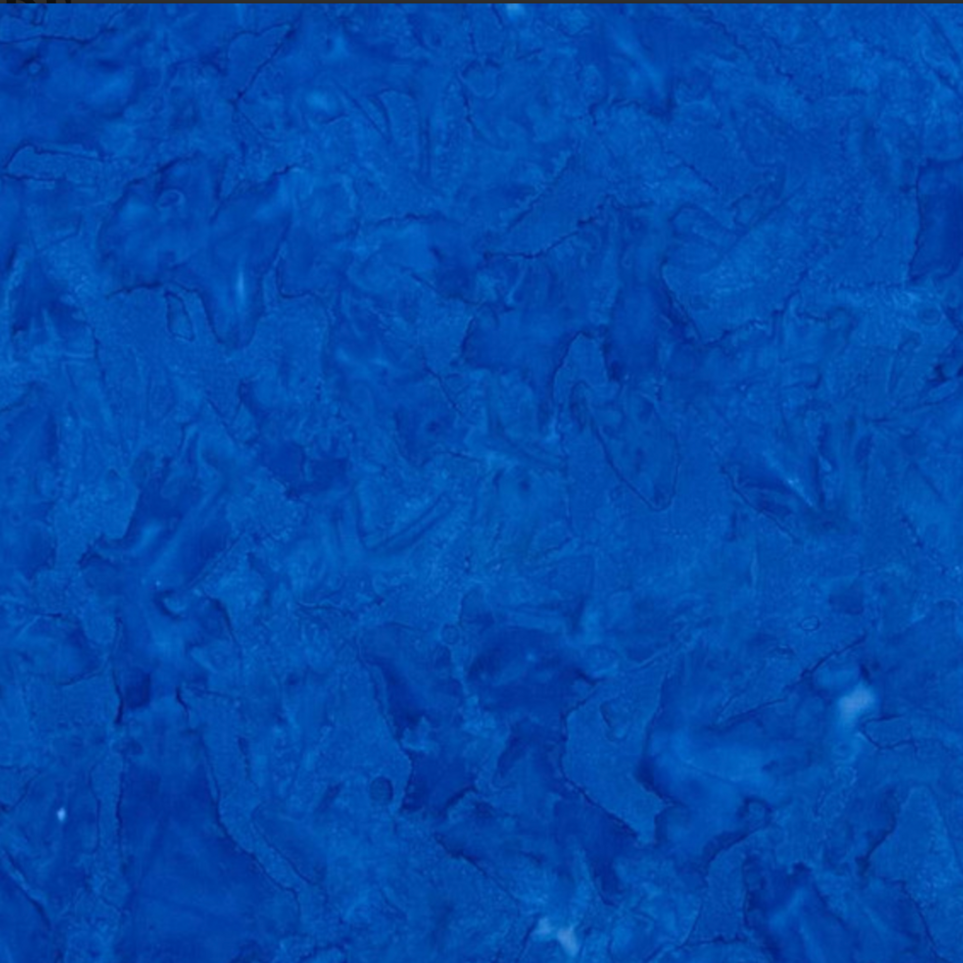 Close-up detail of Expressions Batiks Hand-Dyed Cobalt quilting cotton fabric highlighting print clarity and texture