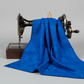 Expressions Batiks Hand-Dyed Cobalt quilting cotton draped over a vintage sewing machine to show softness and movement