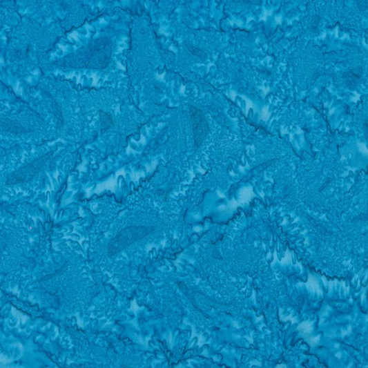 Close-up of Expressions Batiks Hand-Dyes Hand-Dyed Ocean Blue quilting cotton fabric by Riley Blake Designs showing hand-dyed tonal texture and subtle batik surface detail