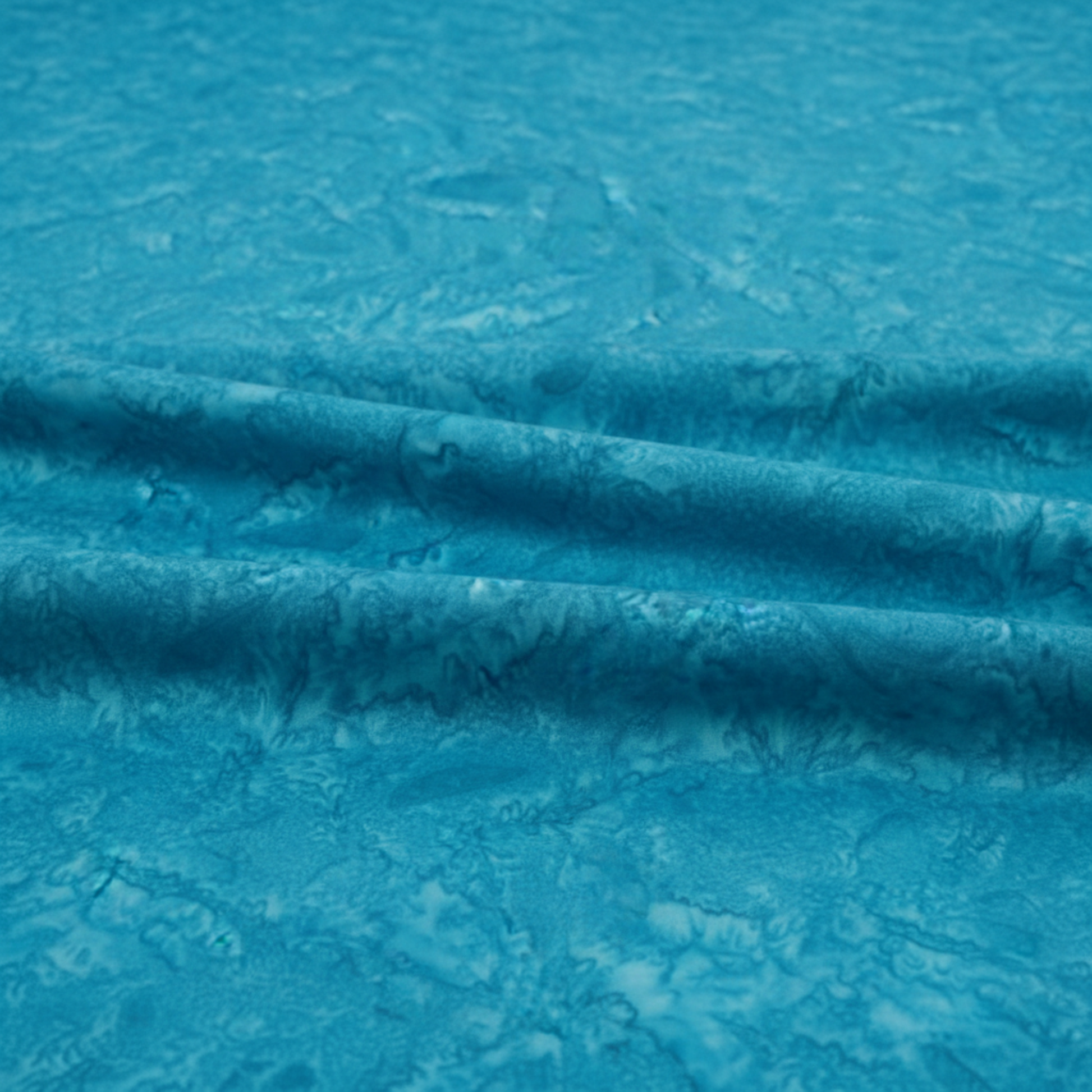 Expressions Batiks Hand-Dyes Hand-Dyed Ocean Blue quilting cotton fabric by Riley Blake Designs – ocean blue batik arranged in soft folds on flat surface to show drape and texture