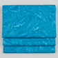 Ocean blue hand-dyed batik quilting cotton fabric by Riley Blake Designs from Expressions Batiks Hand-Dyes – modern blender fabric on light grey background