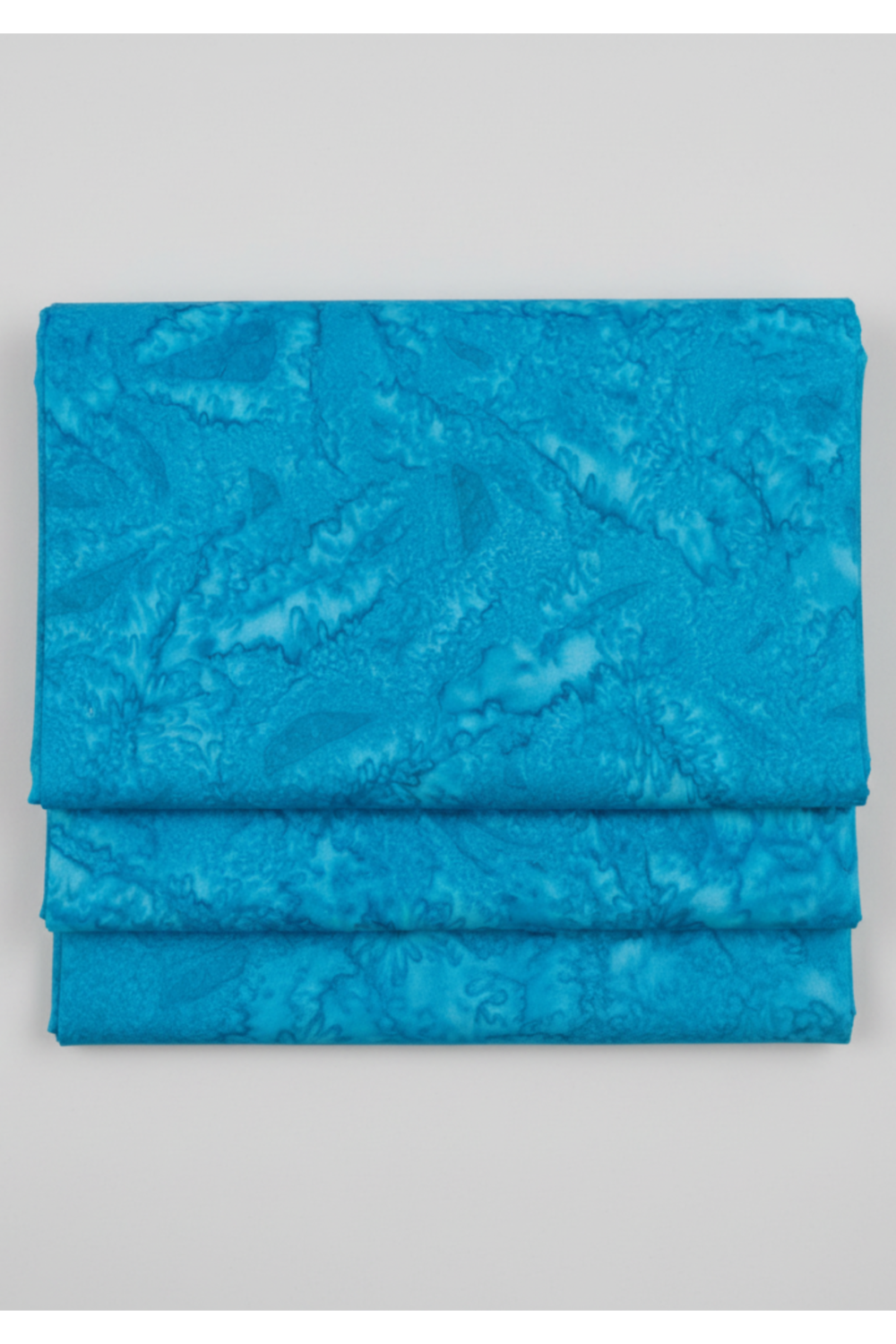 Ocean blue hand-dyed batik quilting cotton fabric by Riley Blake Designs from Expressions Batiks Hand-Dyes – modern blender fabric on light grey background
