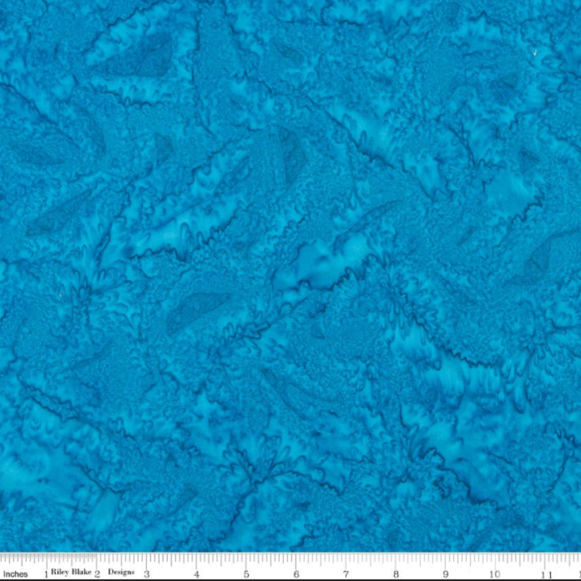 Expressions Batiks Hand-Dyes Hand-Dyed Ocean Blue quilting cotton fabric by Riley Blake Designs – ocean blue batik with tonal variation shown with measuring scale for size reference