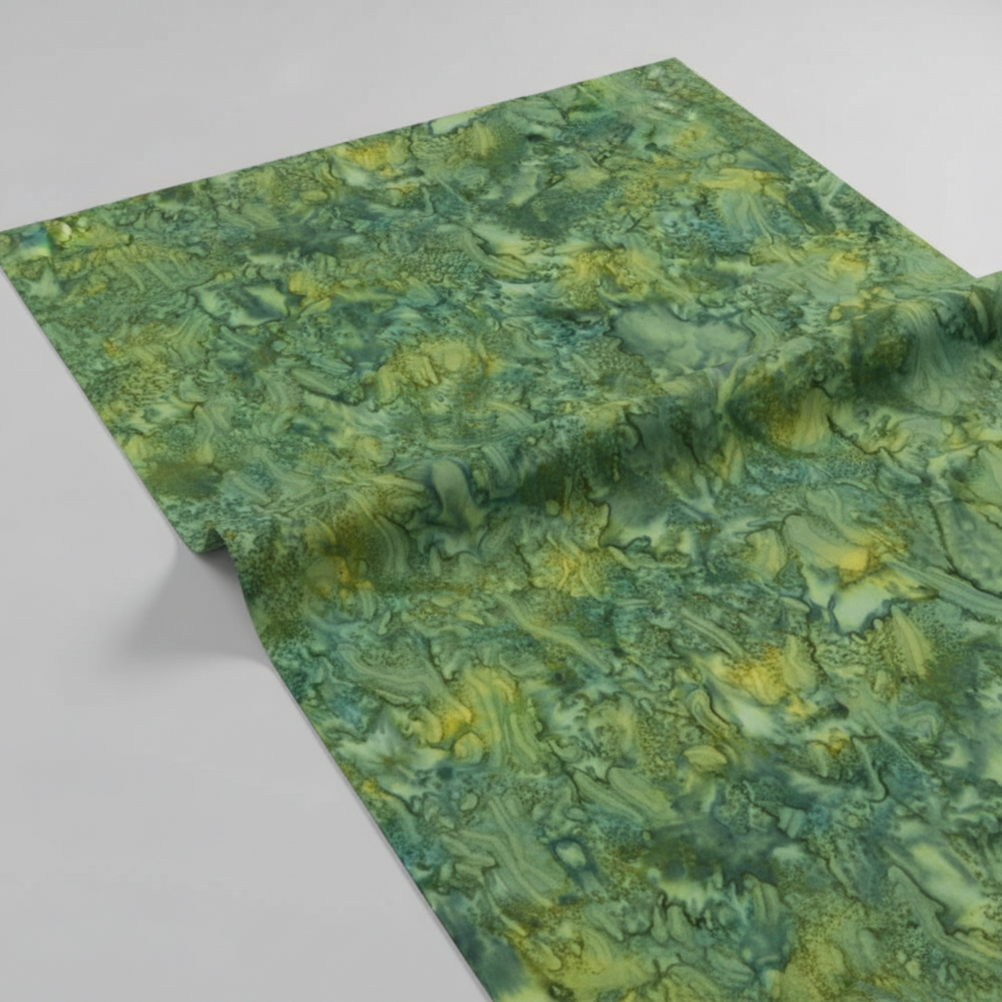 Expressions Batiks Hand-Dyed Amazon quilting cotton draped over a flat surface with soft folds to show softness and movement