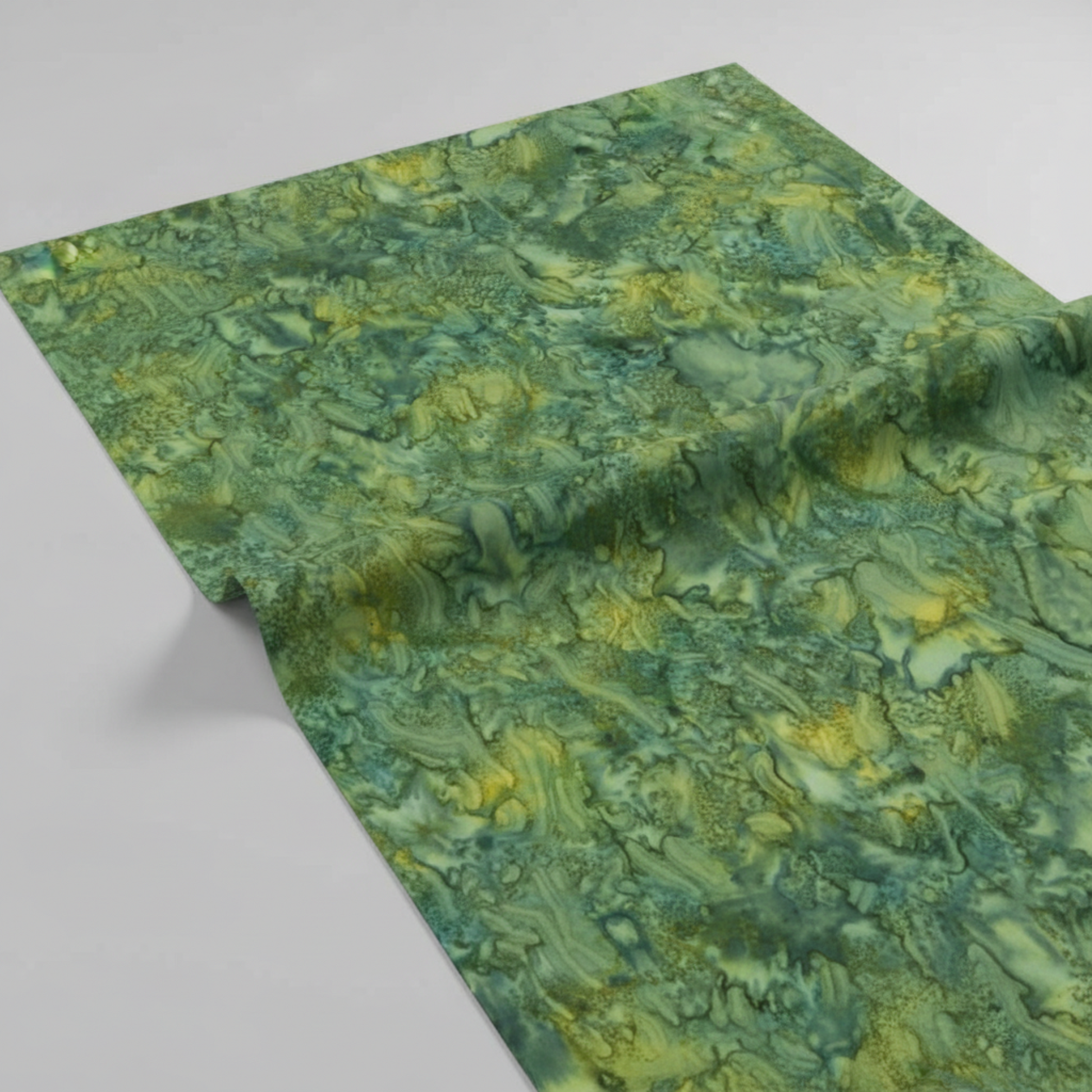 Expressions Batiks Hand-Dyed Amazon quilting cotton draped over a flat surface with soft folds to show softness and movement